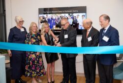 Bob & Renee Parsons cutting a blue ribbon at the opening of The Parsons Research Center for Psychedelic Healing at Mount Sinai.
