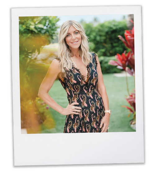 Renee Parsons standing in a field of flowers